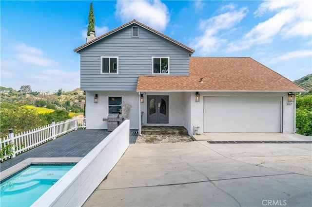 3564 Poppy Dr, Calabasas, CA 91302 - exterior space with french doors, a garage, stucco siding, fence, and concrete driveway