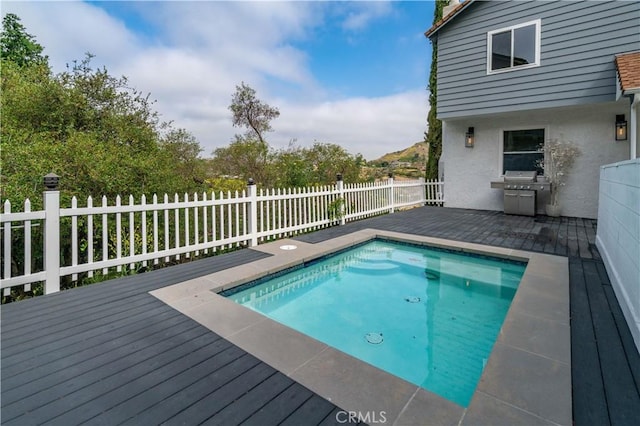 3564 Poppy Dr, Calabasas, CA 91302 - view of swimming pool with a deck, grilling area, a fenced in pool, and fence private yard
