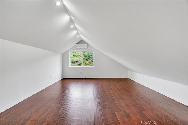 3564 Poppy Dr, Calabasas, CA 91302 - bonus room with dark wood finished floors, vaulted ceiling, recessed lighting, an AC wall unit, and baseboards