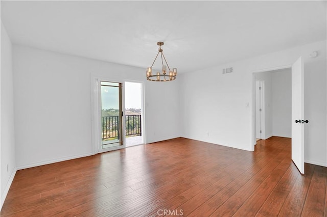 3564 Poppy Dr, Calabasas, CA 91302 - unfurnished room with an inviting chandelier, visible vents, baseboards, and hardwood / wood-style floors