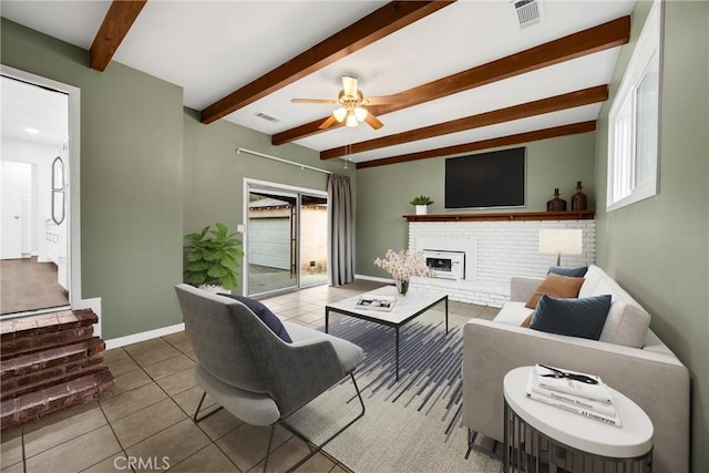 13023 Woodcock Ave, Sylmar, CA 91342 - living area with beam ceiling, tile patterned floors, a fireplace, ceiling fan, and baseboards