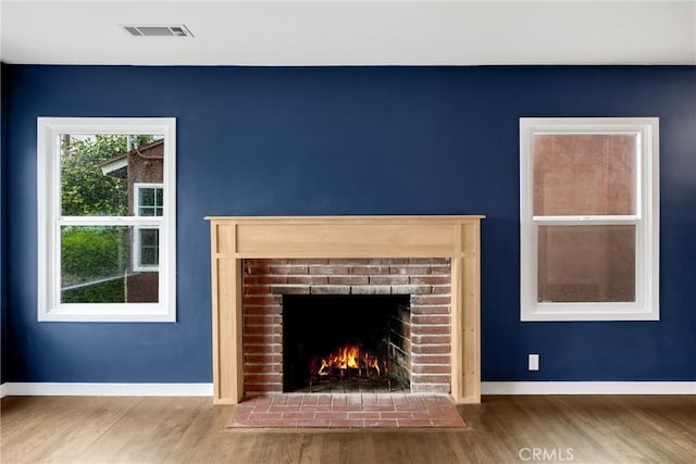 13023 Woodcock Ave, Sylmar, CA 91342 - detailed view of wood finished floors, baseboards, and a fireplace
