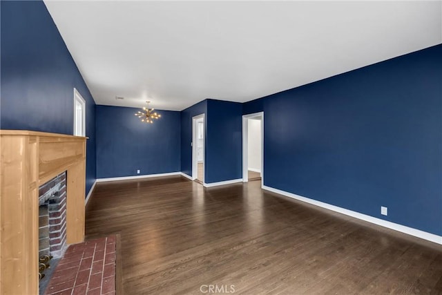 13023 Woodcock Ave, Sylmar, CA 91342 - unfurnished living room with a fireplace with flush hearth, a chandelier, wood finished floors, and baseboards