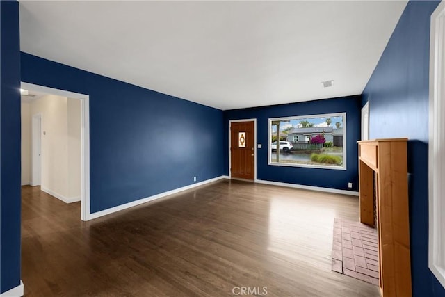 13023 Woodcock Ave, Sylmar, CA 91342 - unfurnished room with wood finished floors and baseboards