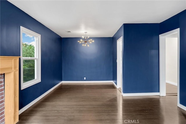 13023 Woodcock Ave, Sylmar, CA 91342 - unfurnished dining area featuring a chandelier, wood finished floors, and baseboards