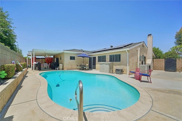 6253 Hamilton Ct, Chino, CA 91710 - view of pool with a patio area, a fenced backyard, cooling unit, and a gate