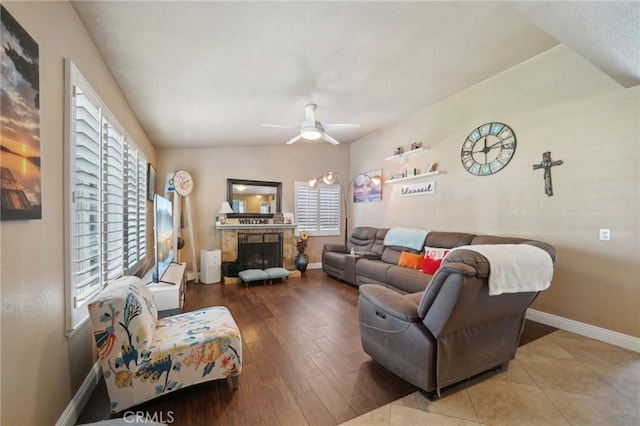 6253 Hamilton Ct, Chino, CA 91710 - living area with baseboards, a ceiling fan, a fireplace, lofted ceiling, and wood finished floors