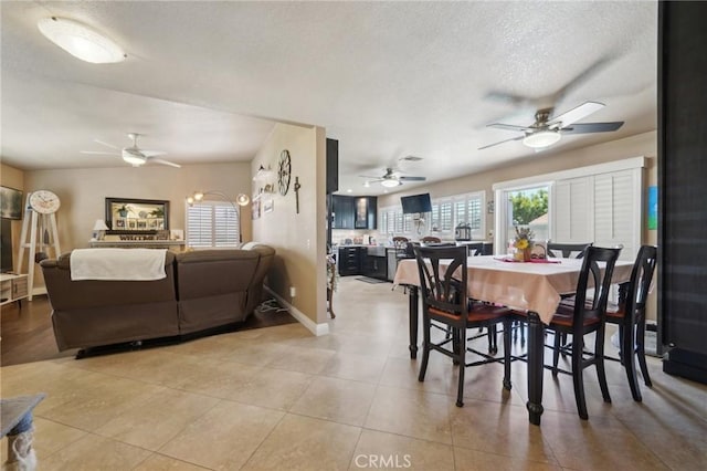 6253 Hamilton Ct, Chino, CA 91710 - dining area featuring a ceiling fan, a textured ceiling, tile patterned floors, and baseboards