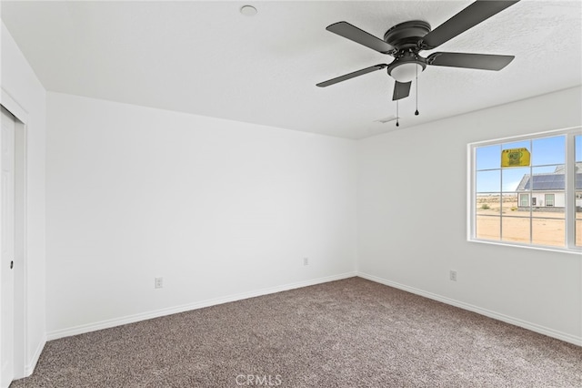 16925 Nanticoke Rd, Apple Valley, CA 92307 - unfurnished bedroom with carpet flooring, a closet, baseboards, and ceiling fan