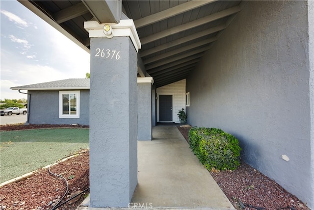 26376 Mahaffey, Menifee, CA 92586 - property entrance with stucco siding and a yard