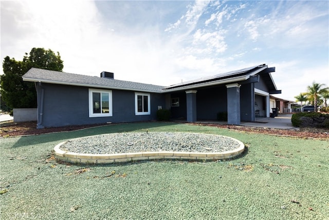 26376 Mahaffey, Menifee, CA 92586 - rear view of house featuring solar panels, a yard, and stucco siding