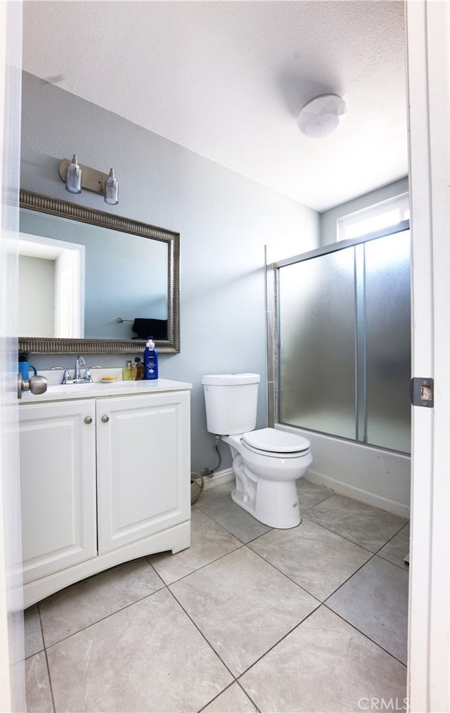 26376 Mahaffey, Menifee, CA 92586 - bathroom with toilet, shower / bath combination with glass door, vanity, and tile patterned floors