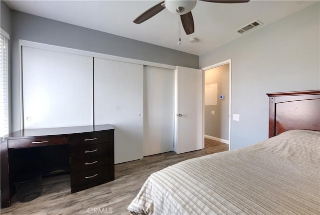 26376 Mahaffey, Menifee, CA 92586 - bedroom with light wood-style flooring, a closet, and a ceiling fan