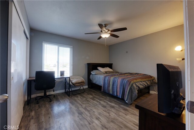 26376 Mahaffey, Menifee, CA 92586 - bedroom with wood finished floors, a desk, a ceiling fan, and a closet