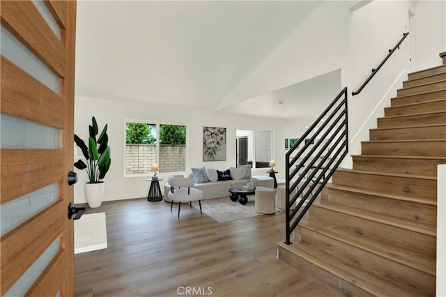21011 N Hampton Way, Lake Forest, CA 92630 - living room with stairway, dark wood-style flooring, baseboards, and high vaulted ceiling