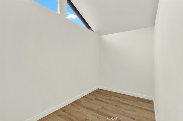 21011 N Hampton Way, Lake Forest, CA 92630 - unfurnished room featuring baseboards, vaulted ceiling, and light wood-style floors