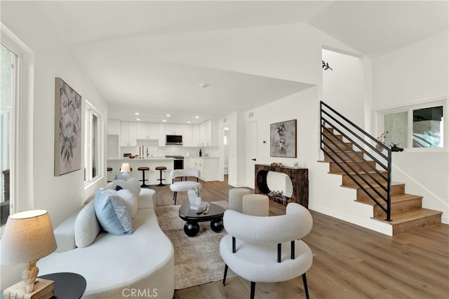 21011 N Hampton Way, Lake Forest, CA 92630 - living room featuring light wood-type flooring, stairs, high vaulted ceiling, and recessed lighting