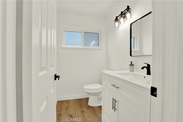 21011 N Hampton Way, Lake Forest, CA 92630 - bathroom featuring toilet, wood finished floors, vanity, ornamental molding, and baseboards