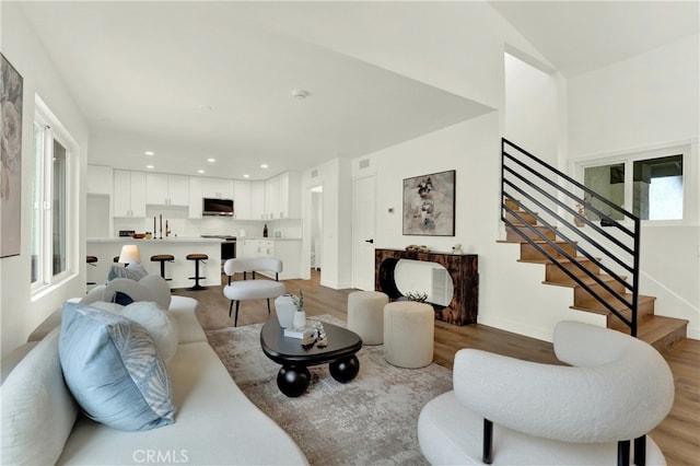 21011 N Hampton Way, Lake Forest, CA 92630 - living area with stairway, light wood-style floors, recessed lighting, and baseboards