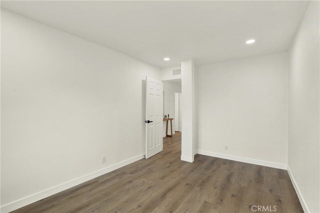 21011 N Hampton Way, Lake Forest, CA 92630 - empty room with wood finished floors, recessed lighting, and baseboards