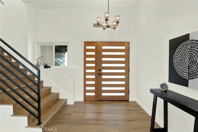 21011 N Hampton Way, Lake Forest, CA 92630 - entryway with stairway, a chandelier, wood finished floors, baseboards, and a towering ceiling