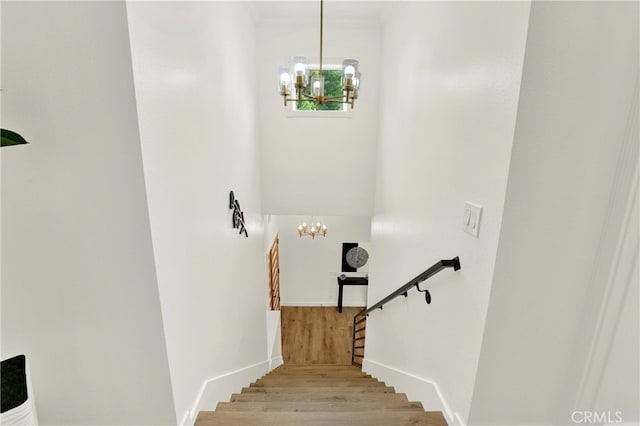 21011 N Hampton Way, Lake Forest, CA 92630 - stairs featuring a chandelier and wood finished floors