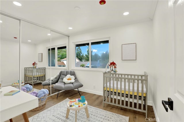 21011 N Hampton Way, Lake Forest, CA 92630 - bedroom featuring a crib, wood finished floors, baseboards, recessed lighting, and ornamental molding