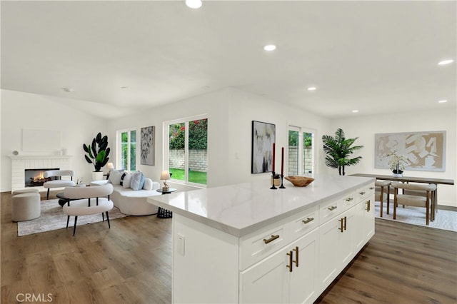21011 N Hampton Way, Lake Forest, CA 92630 - kitchen with wood finished floors, recessed lighting, open floor plan, white cabinets, and a kitchen island