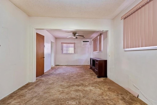 interior space featuring a textured ceiling and carpet floors