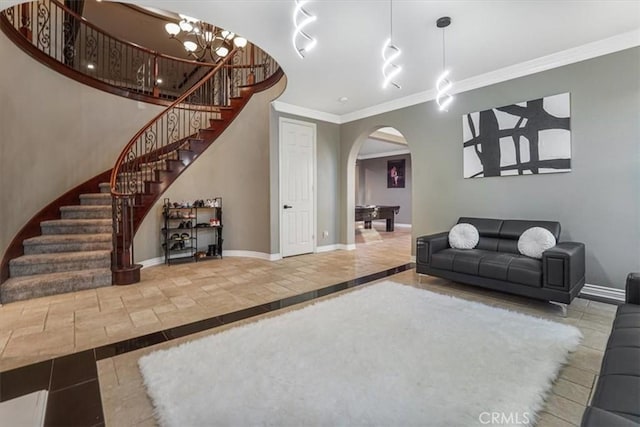 200 Cross Rail Ln, Norco, CA 92860 - living area featuring arched walkways, inlaid floor details, baseboards, stairway, and ornamental molding