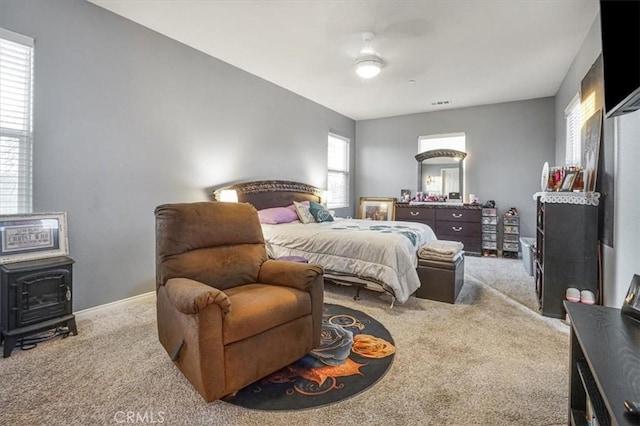 200 Cross Rail Ln, Norco, CA 92860 - bedroom featuring carpet flooring, a wood stove, and baseboards