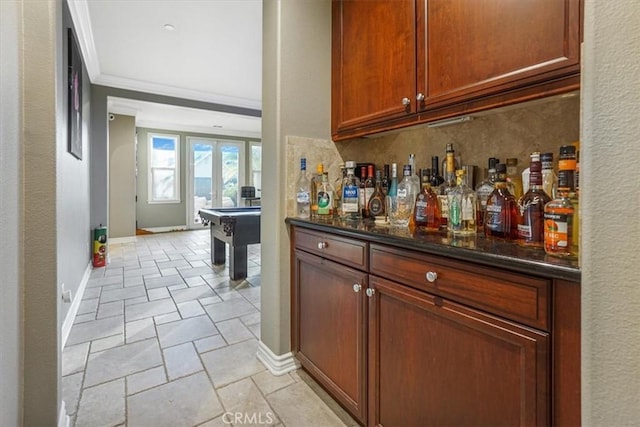 200 Cross Rail Ln, Norco, CA 92860 - indoor dry bar with ornamental molding, stone tile flooring, french doors, and baseboards