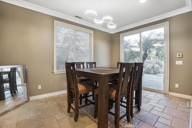 200 Cross Rail Ln, Norco, CA 92860 - dining space featuring stone tile flooring, baseboards, and crown molding