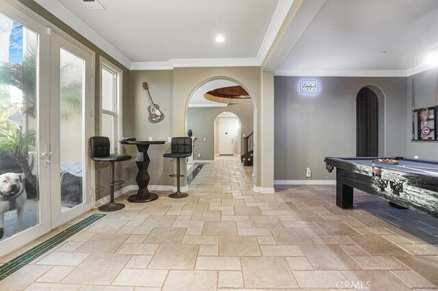 200 Cross Rail Ln, Norco, CA 92860 - rec room with arched walkways, stone tile flooring, crown molding, and plenty of natural light