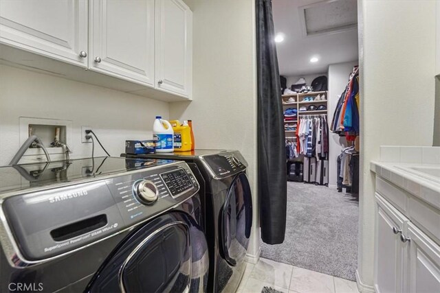 200 Cross Rail Ln, Norco, CA 92860 - clothes washing area with separate washer and dryer, cabinet space, light carpet, attic access, and light tile patterned floors
