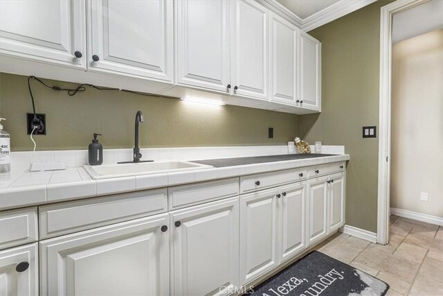 200 Cross Rail Ln, Norco, CA 92860 - laundry room with a sink and baseboards