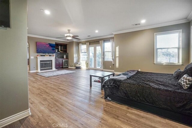 200 Cross Rail Ln, Norco, CA 92860 - bedroom featuring crown molding, baseboards, access to exterior, wood finished floors, and recessed lighting