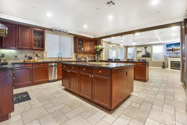 200 Cross Rail Ln, Norco, CA 92860 - kitchen with dark countertops, a center island with sink, stone tile flooring, a sink, and dark brown cabinets
