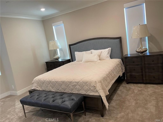 bedroom featuring ornamental molding, carpet floors, and baseboards