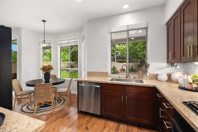 15 Saltillo, Rancho Santa Margarita, CA 92688 - kitchen featuring dishwasher, a sink, light stone countertops, dark brown cabinetry, and recessed lighting
