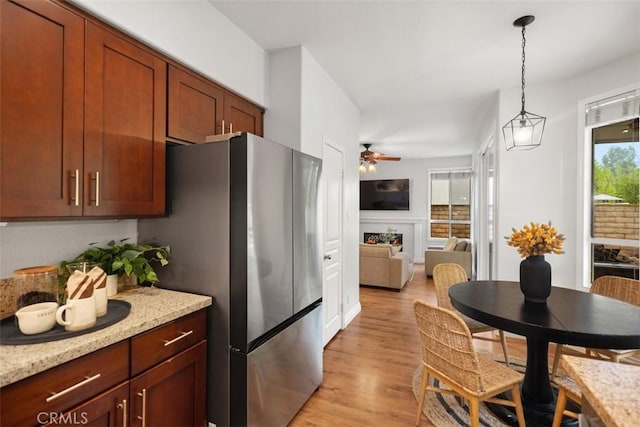 15 Saltillo, Rancho Santa Margarita, CA 92688 - kitchen featuring freestanding refrigerator, light wood finished floors, decorative light fixtures, and a ceiling fan