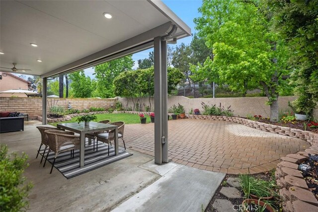 15 Saltillo, Rancho Santa Margarita, CA 92688 - view of patio with a fenced backyard, outdoor dining area, and a ceiling fan