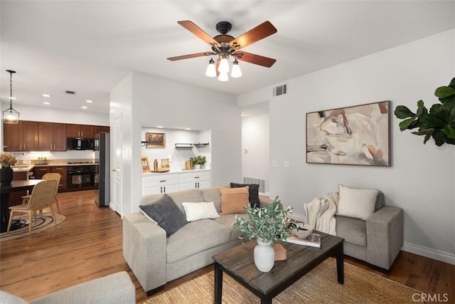 15 Saltillo, Rancho Santa Margarita, CA 92688 - living area with light wood-type flooring, recessed lighting, ceiling fan, and baseboards