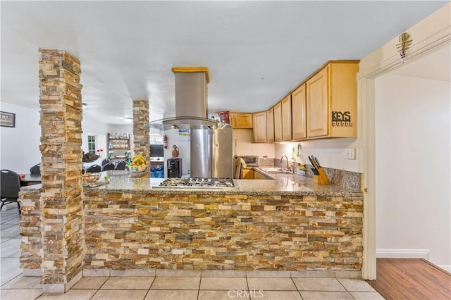 40481 Sage Rd, Hemet, CA 92544 - kitchen featuring light brown cabinets, stainless steel gas stovetop, a sink, island exhaust hood, and ornate columns