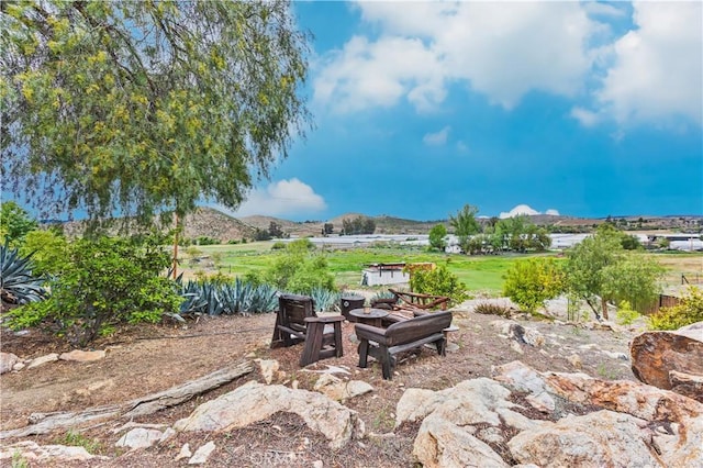 40481 Sage Rd, Hemet, CA 92544 - view of patio / terrace featuring a fire pit and a mountain view