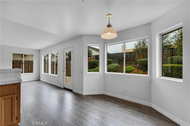 unfurnished sunroom with a healthy amount of sunlight