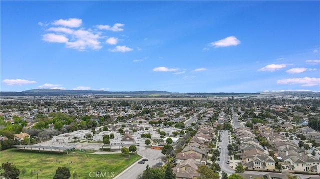 birds eye view of property featuring a mountain view and a residential view