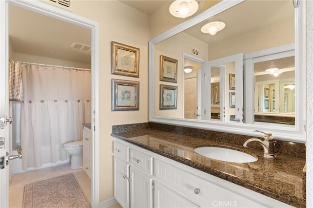 full bathroom with vanity, curtained shower, visible vents, and tile patterned flooring