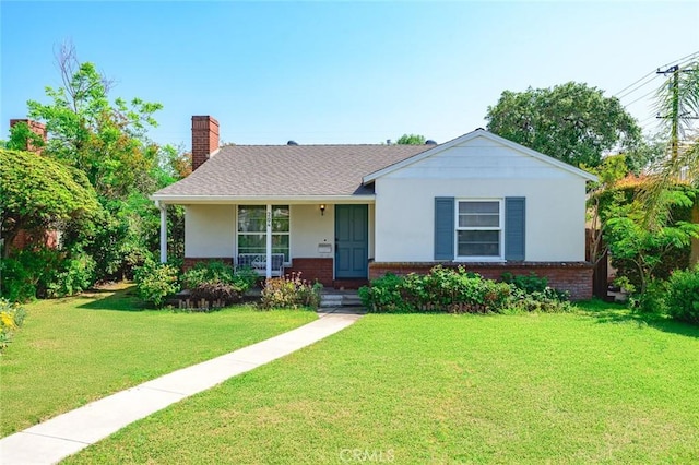 204 E Floral Ave, Arcadia, CA 91006 - view of front facade with a chimney, a front yard, brick siding, a porch, and stucco siding