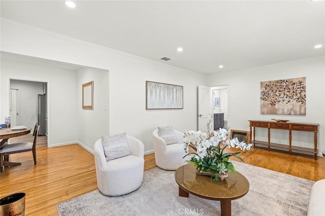 204 E Floral Ave, Arcadia, CA 91006 - living room featuring light wood-type flooring, recessed lighting, ornamental molding, and baseboards